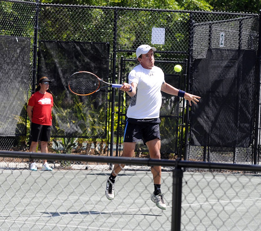 New Zealand's Jose Statham returns a serve during his qualifying singles final April 11.