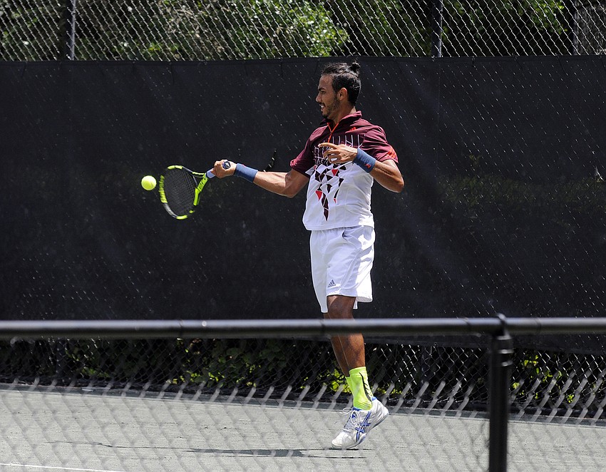 Juan Manuel Benitez Chavarriaga of Colombia competes in a qualifying singles final match.