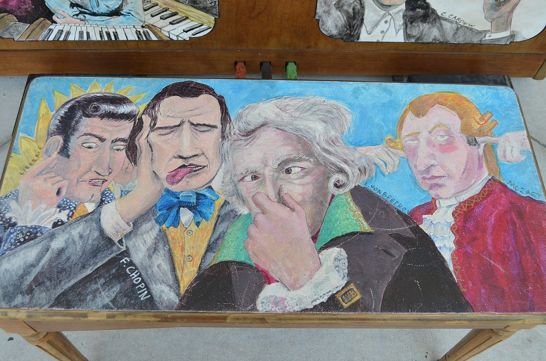 Liberace, Chopin, Beethoven and Mozart are painted on the piano bench in front of Louie's Modern in Downtown Sarasota.