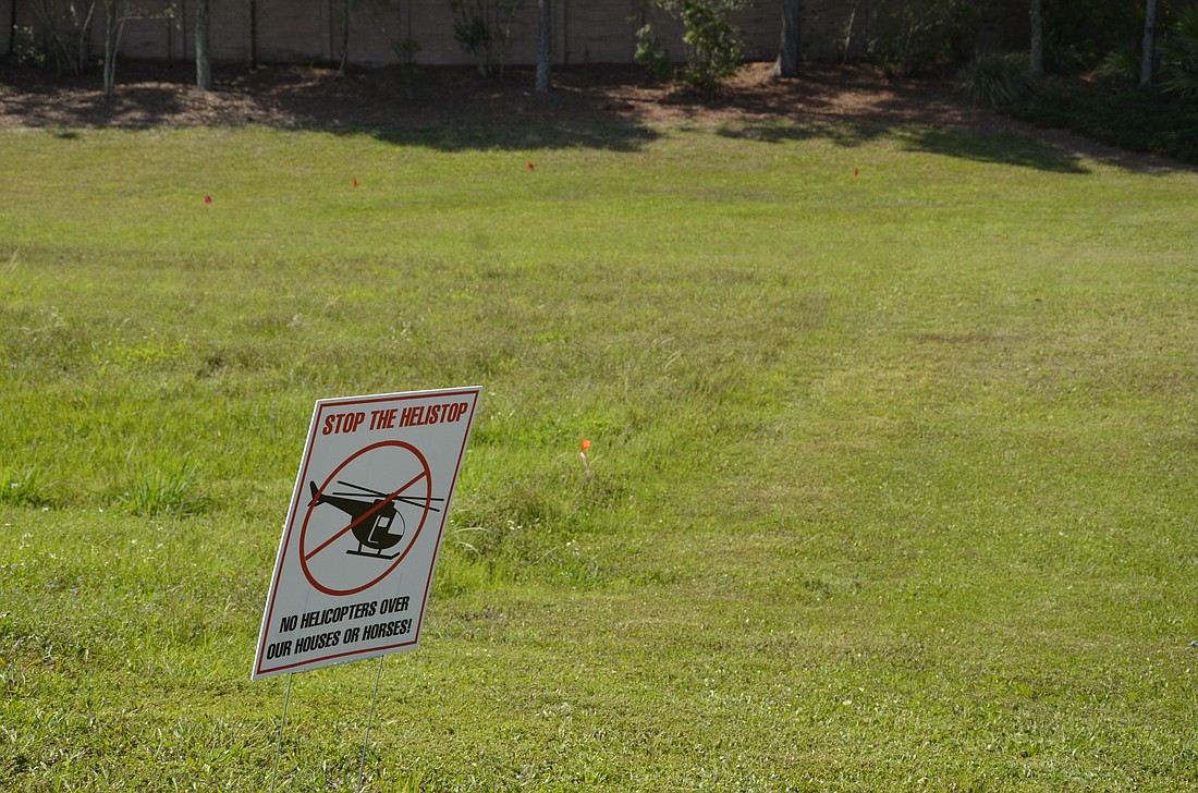 Anti-helistop signs have been posted at the curb of the Greenbrook East and Panther Ridge neighborhoods.