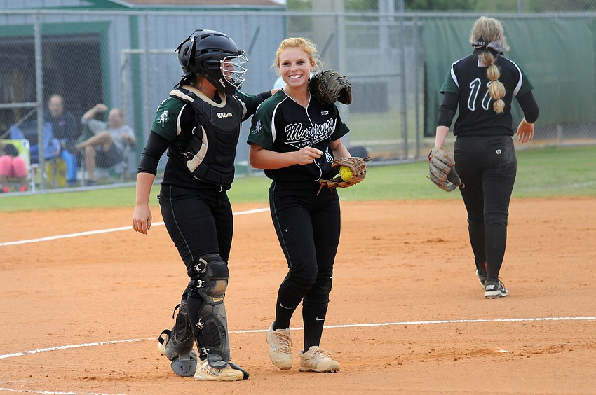 Lakewood Ranch catcher Maddie Biggs talks with pitcher Kailey Christian in the first inning.