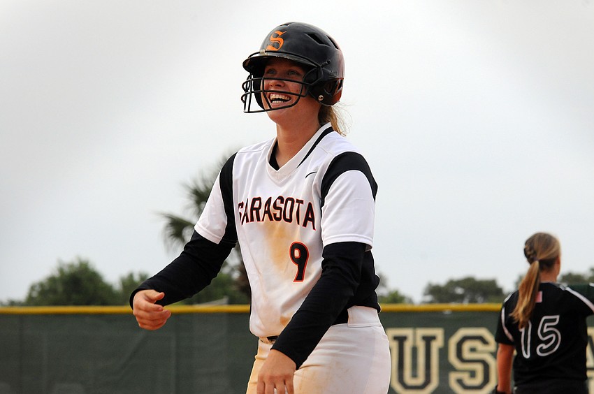 Sarasota senior SarahBeth Wengerd reacts after getting a hit in the first inning.