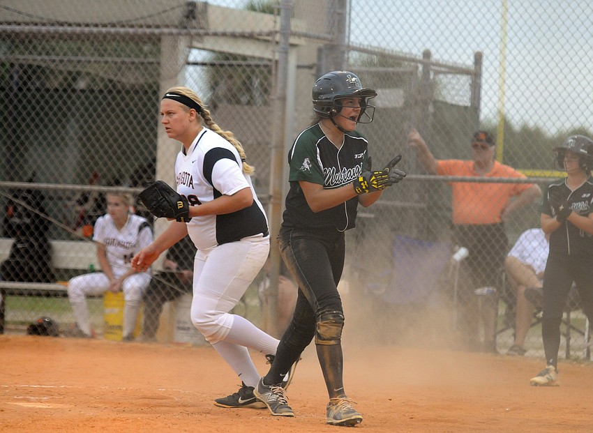 Lakewood Ranch's Kyra Klarkowski celebrates after scoring a run in the bottom of the first inning.