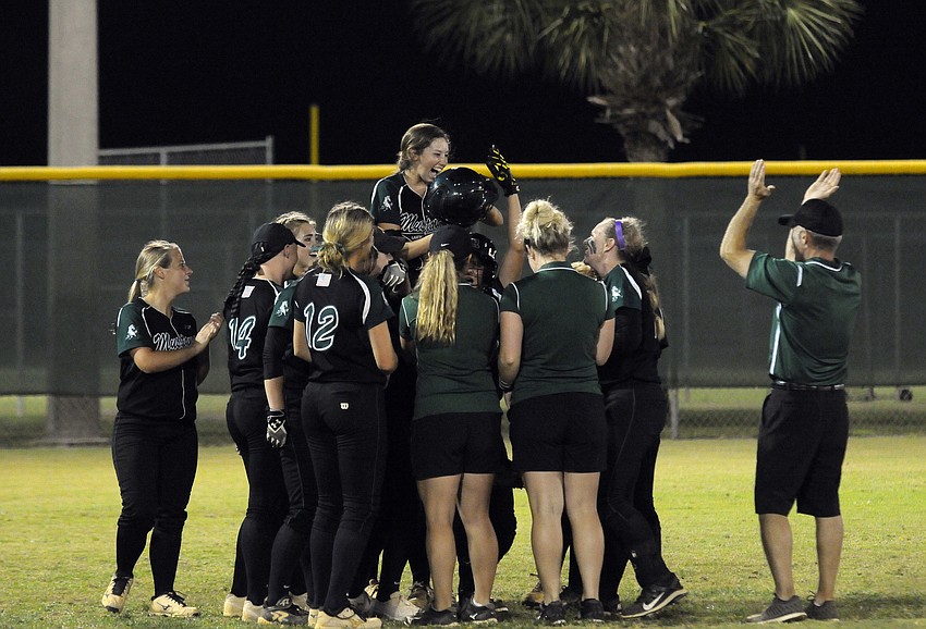 Lakewood Ranch junior Denali Schappacher celebrates with her teammates after hitting her first out-of-the-park home run.
