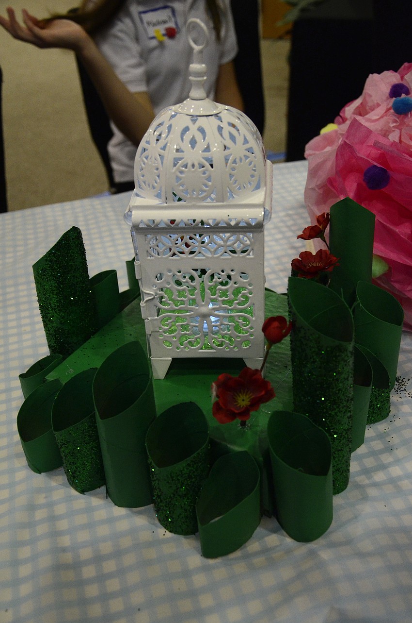 The table centerpieces were mini Emerald Cities made from recycled toilet paper rolls.