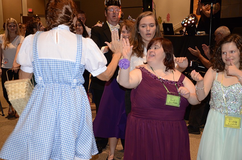 Ginny Calcutti as Dorothy gives April Beckham a high-five.