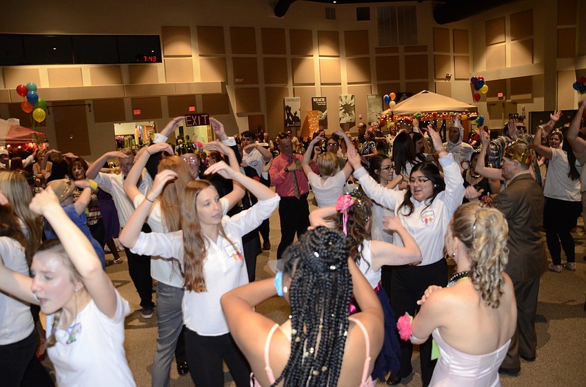 Prom goers dance to the YMCA.