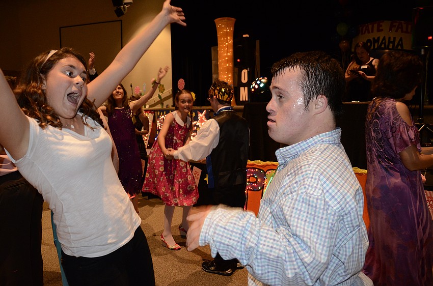 Lakewood Ranch Leaders volunteer Rachel Towe dances the YMCA with Zach Rubin.