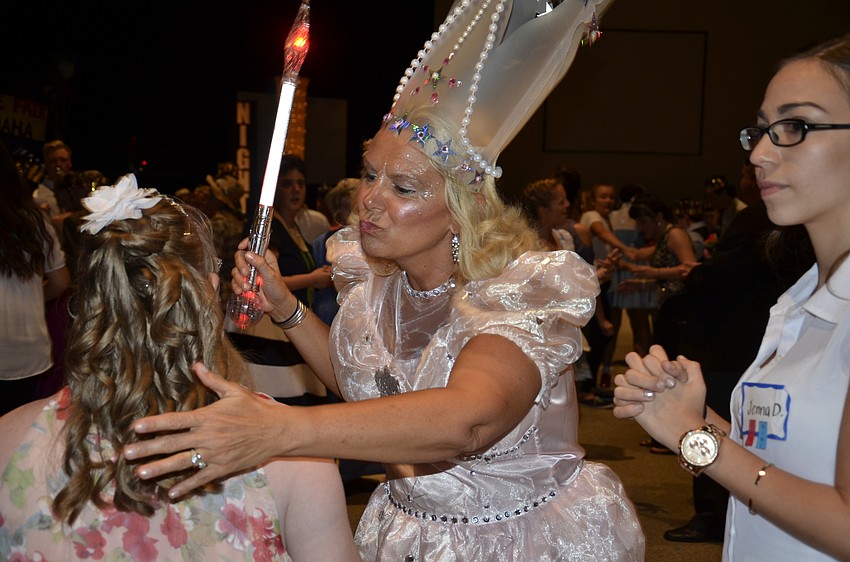 Tonya Waxler greets prom goers as Glenda the Good Witch.