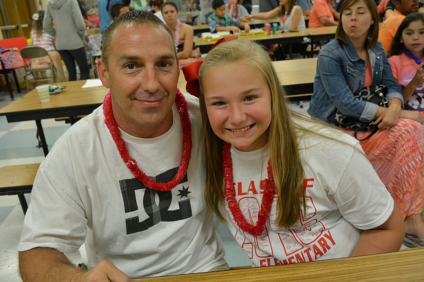 Mark and Savanna Lochner enjoy cookies while waiting for a friend.