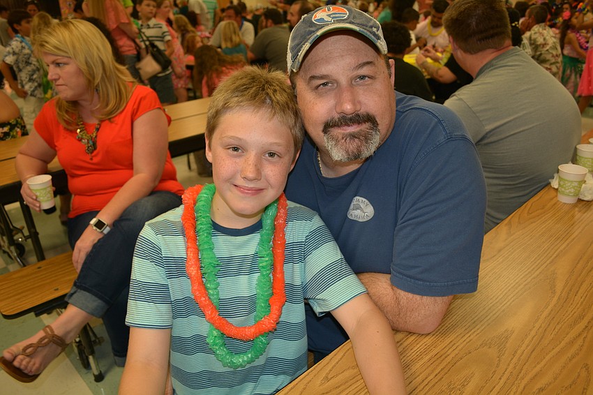 Jakub Dolan, pictured with his father, Chris, is in fourth grade.