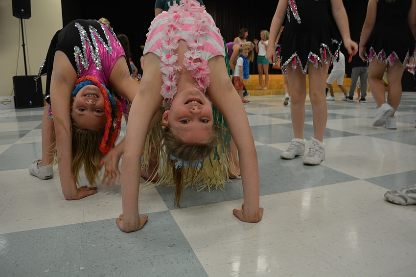 Brooklyn McCutchan and Shae Schooley show off their back bend talents.