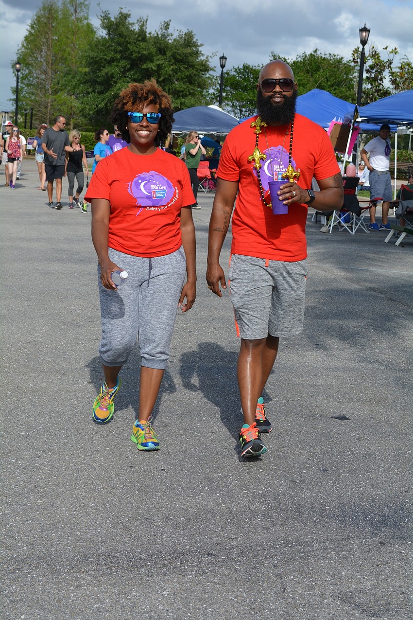Gina and Kameron Beckum, of Lakewood Ranch, walk for Kameron's mother, Tranetta Crosswright, a breast cancer survivor.