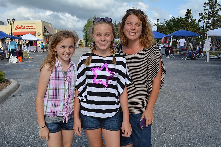 Charlie Hugill stops by Relay for Life booths with friends, Lakewood Ranch residents Ava and Jessica Banks.