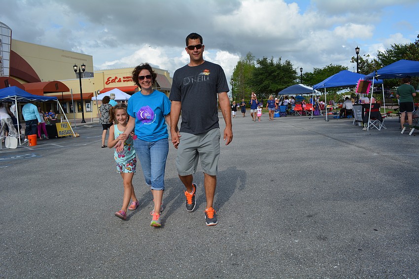 Ella, Miranda and Jason Scznsny, of East County, walk with the School District of Manatee County's Professional Support Center.  