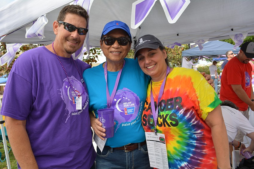 Bob Lennox, left, and his wife, Tammy, right, of #TeamBob, catch up with Fred Lopez, of the Rotary Club of Lakewood Ranch's team.