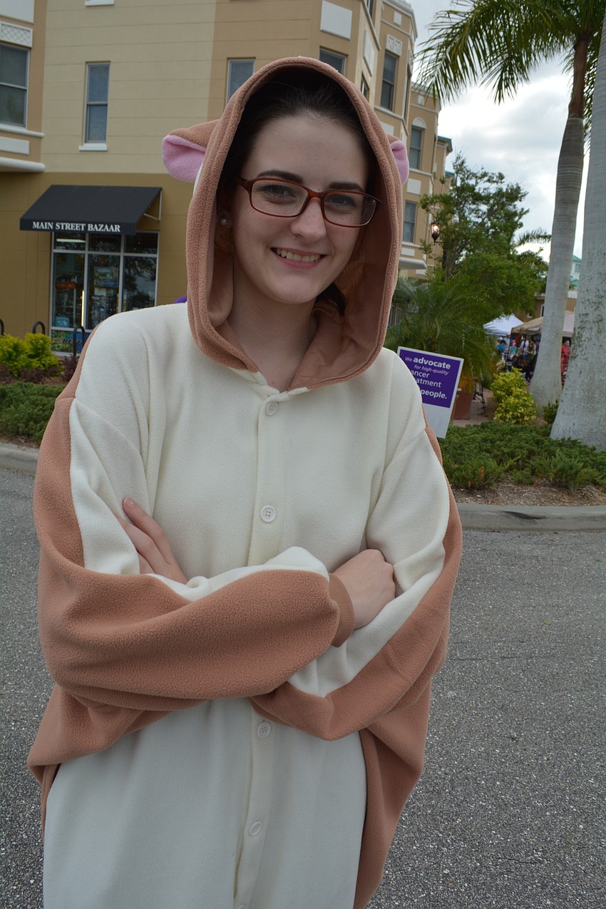 Lakewood Ranch High's Savannah Griffis, 17, pulls out an old Halloween costume of a flying squirrel for the animal lap.