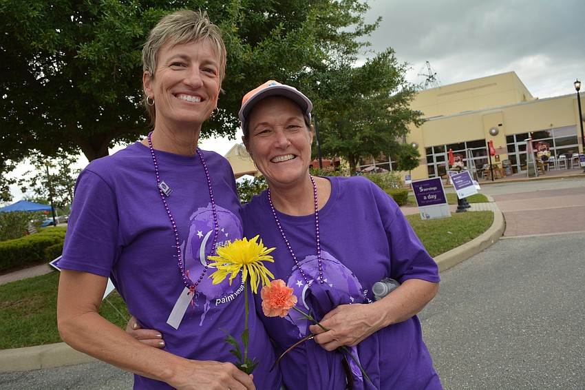 Louann Jessup and Katy Kimbrell, both survivors, teach at Braden River Middle School.