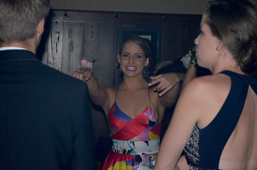 Kate Patrice convinces her friends to dance to the music.