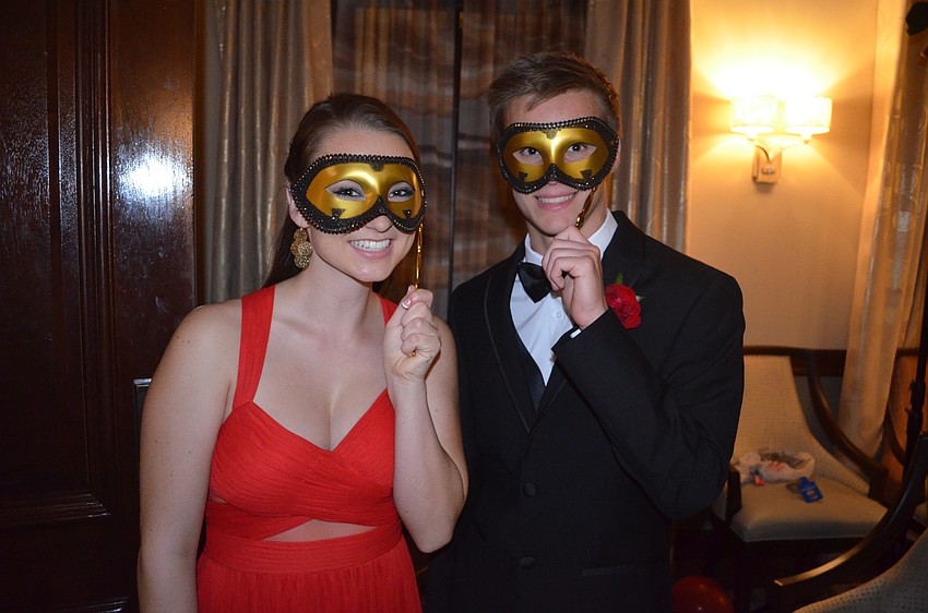 Anne Keen and Michael Donato dress for the masquerade theme.