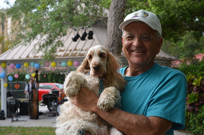 Ken Molnar dances with his pup Sara