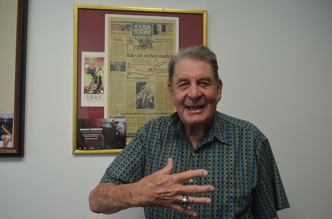 Wolverton shows off his ring and other Oklahoma Sooner memorabilia.