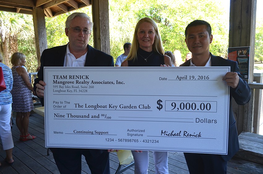 Michael Renick, Garden Club President Susan Phillips and Eric Teoh, with a $9,000 check to the Garden Club from Team Renick.
