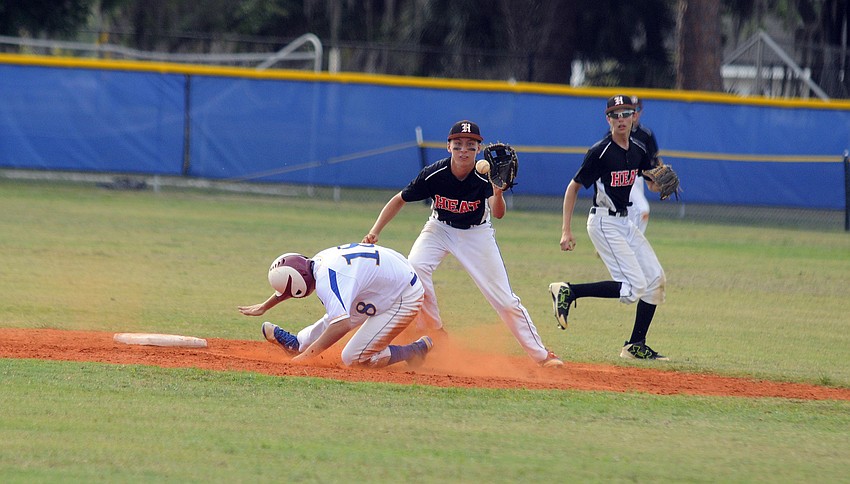Pinch runner Japheth Miller slides safely into second base.