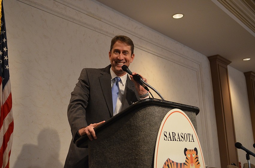 Morgan Bentley hurries guests to take their seats to start the panel.