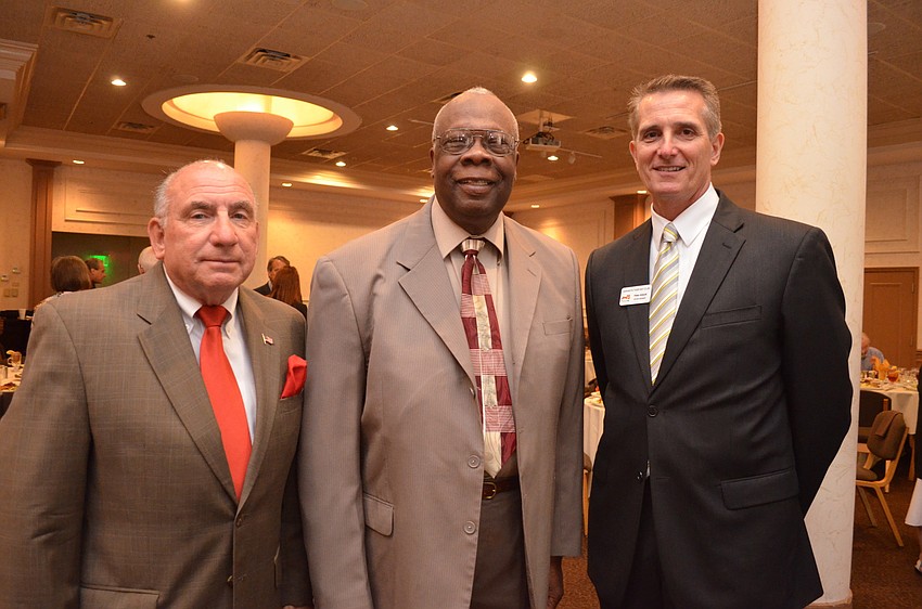 Norman Schimmel, board member of the Tourist Development Council, Mayor Willie Shaw and Peter Abbott