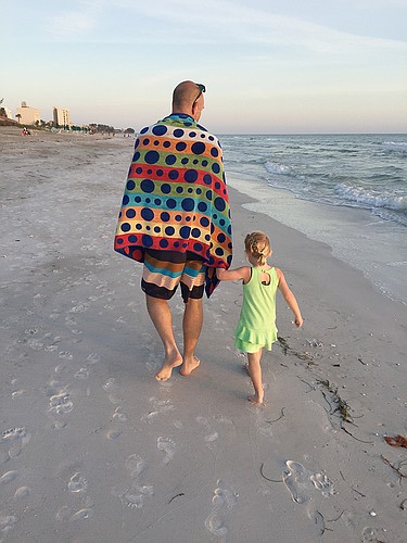 Gerry Dice submitted this photo of her grandson, Nate VanDrunen, and great-grandaughter, Winnie, walking along the beach on Longboat Key.