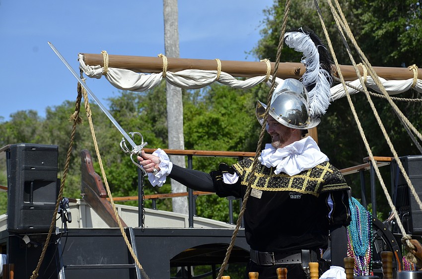 Crewe Captain Paul Webb draws his sword, to the delight of the third-grade class.