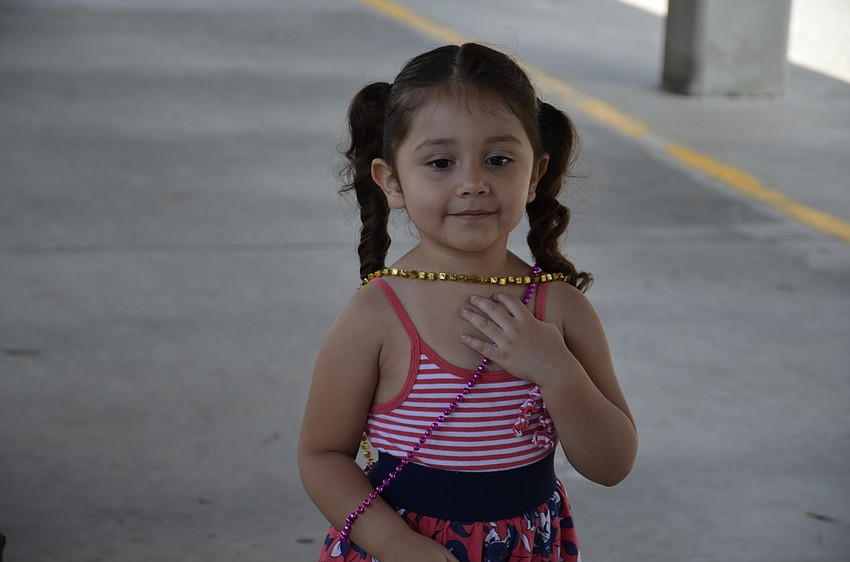 Hazelley Rodriguez, 3, got to see the conquistadors while visiting her third-grade brother, Gerardo Gonzales.
