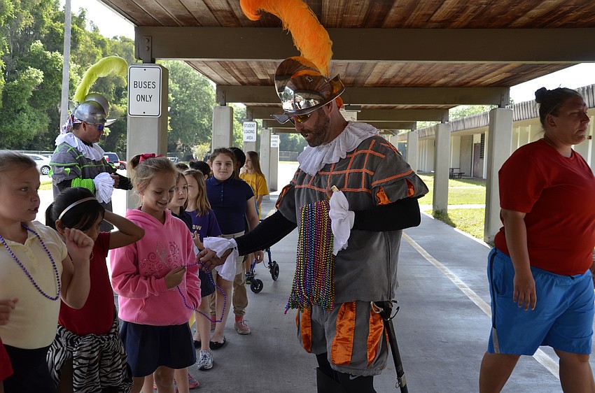 Jay Walker gives Sophia Pippin a necklace.
