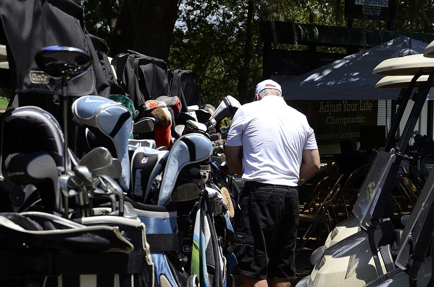 Brian Motherway of Bradenton prepares his cart before the tournament starts.