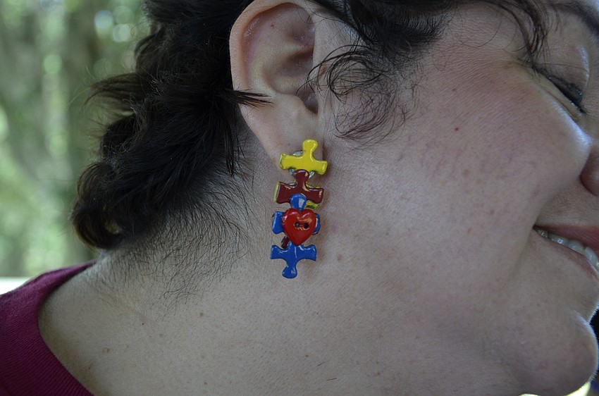 Nancy Basile wore her autism awareness earrings for the event.