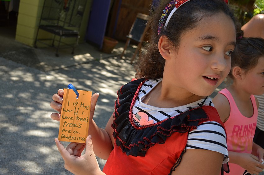 Amaris Gonzalez- Guerra wrote her wish to hang on the tree.