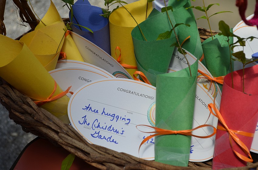 Visitors each left with oak tree saplings to plant in honor of Arbor Day.