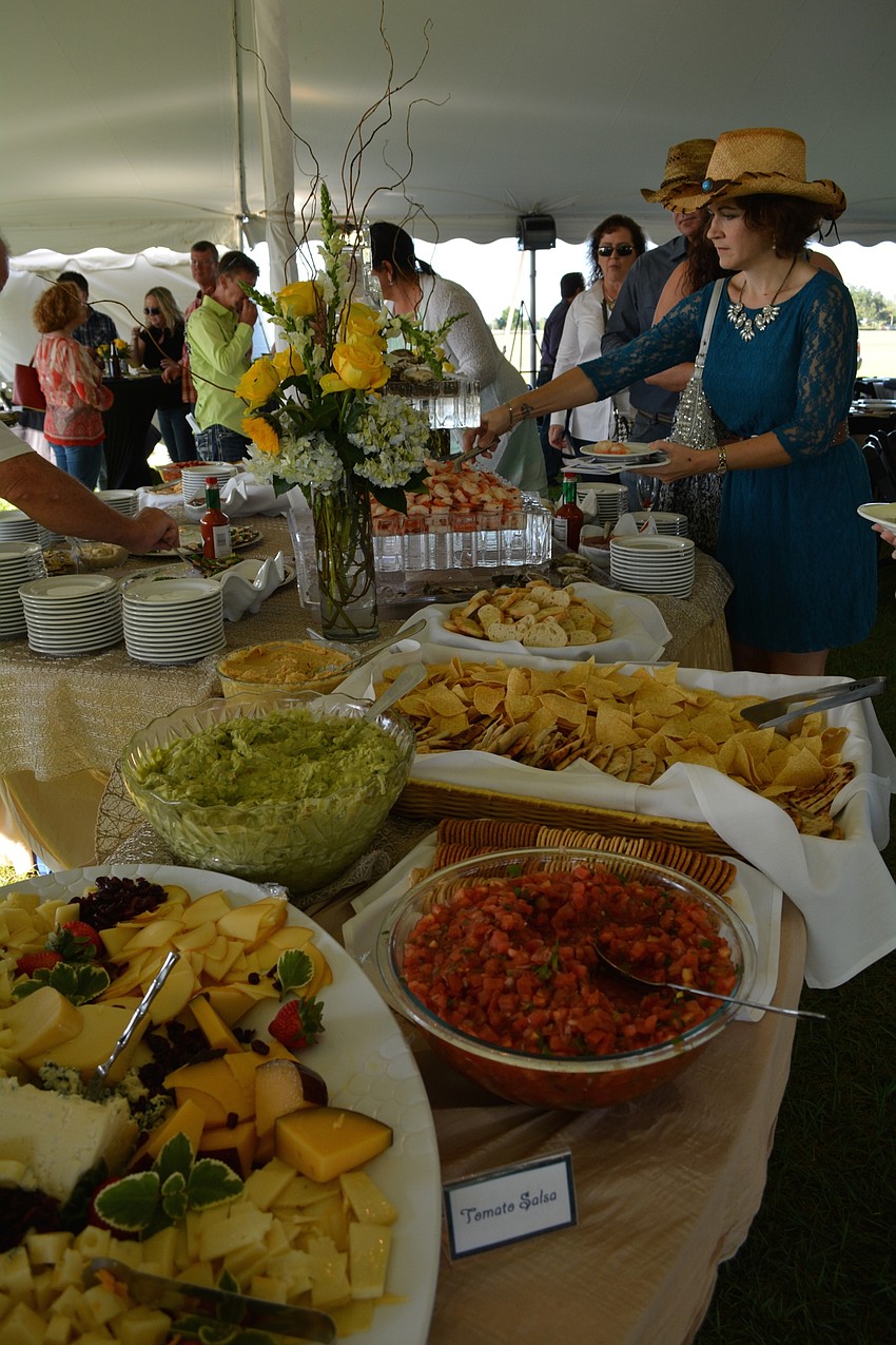 Guests enjoy an elaborate appetizer buffet before dinner.