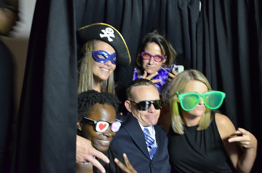 Faculty members Jessica Lucas, Sue Ulrich, Marsha Seagrave, Joe Collis and Casey Garrett had their fun in the photo booth.