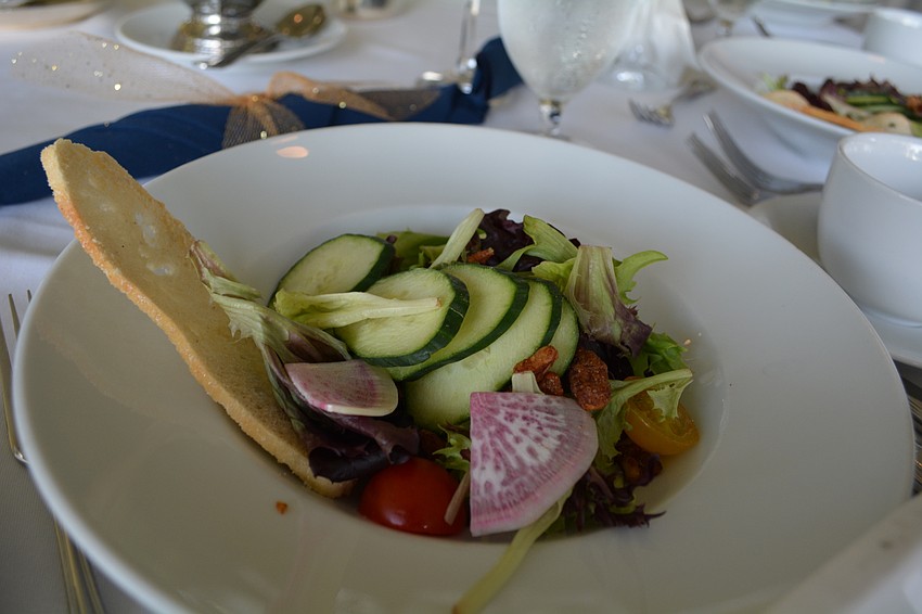 Guests start their dinner with a fresh salad.