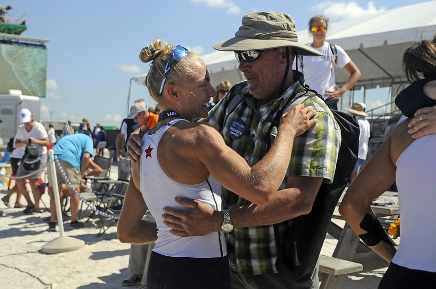 Gregory Kemp congratulates Monica Whitehouse on her third-place finish.