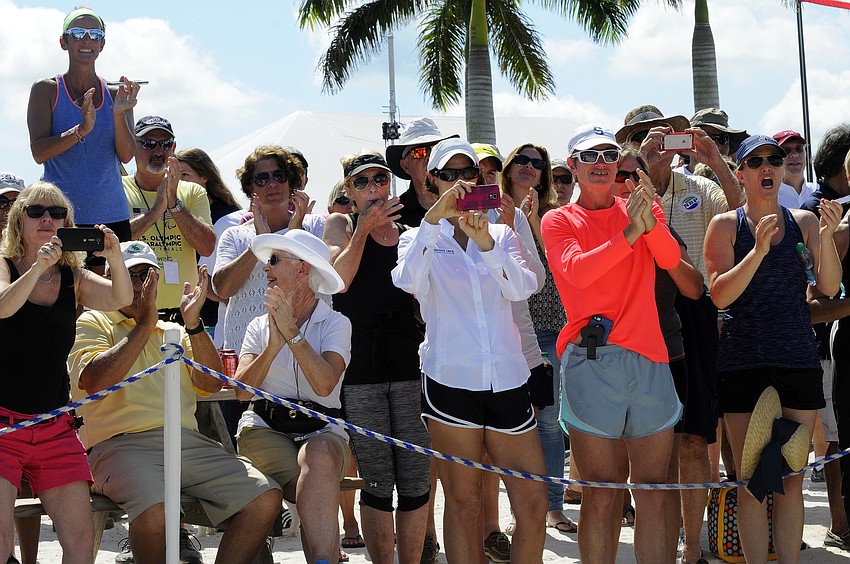 Spectators celebrate after watching Sarasota Crew's Monica Whitehouse and Rosa Kemp win a bronze medal in the women's lightweight 2x.