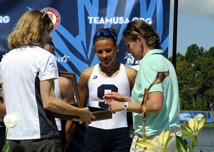 Sarasota Crew's Rosa Kemp receives her bronze medal for the women's lightweight 2x.