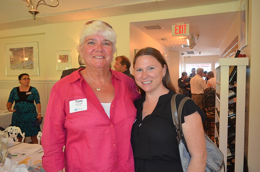 Toni Lyon, of The Islander, and Shawn Shields, of LaPensee Plumbing, Pools and Air