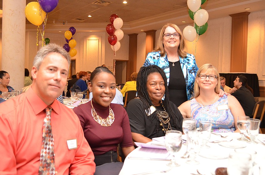 Riverview High School Principal Eric Jackson sits with junior Hermoine Weaver, Betty Weaver, Dusty Twining and Kathryn Sperber.