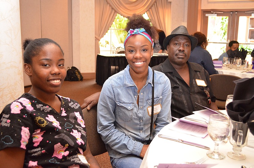 Kondril Thomas with Riverview High School senior Irena Wilcox and Bruce Wilcox.