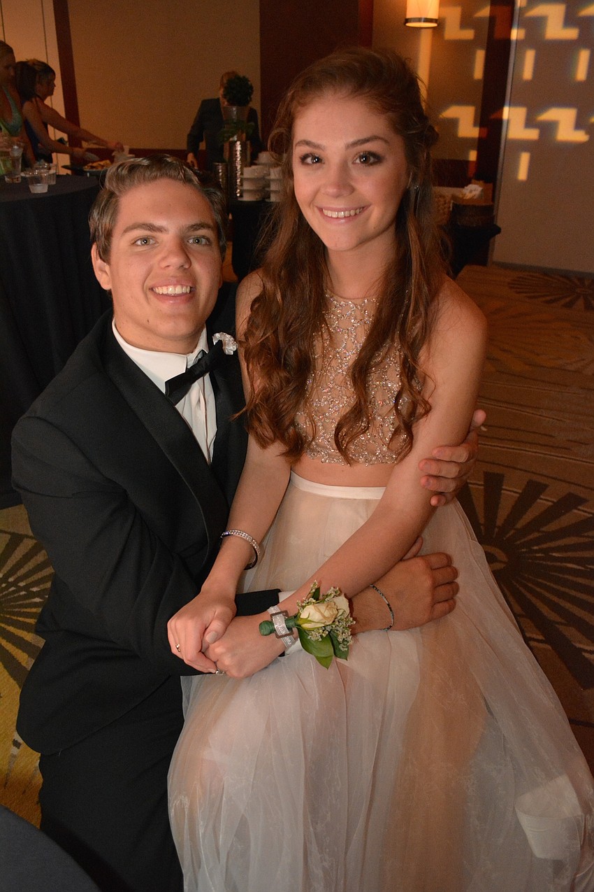 Connor Kelly and Olivia Lersch wait for the perfect moment to hit the dance floor.