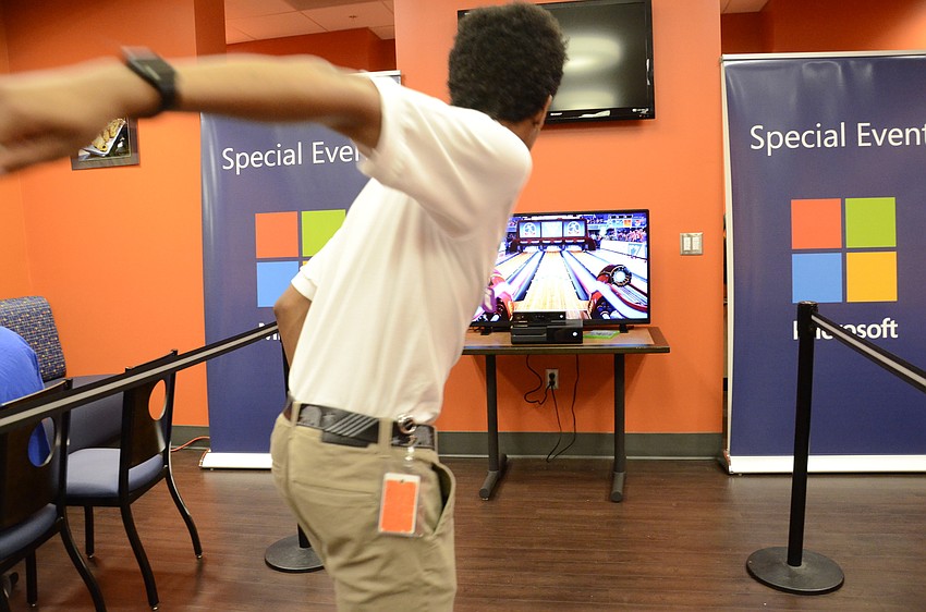 Gabe Taylor of Bradenton bowls in a interactive game developed by Microsoft, which requires no controllers.