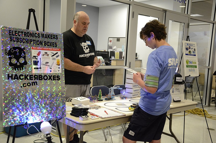 Joseph Long talks with Micah Basinger of Bradenton about his hacker boxes.